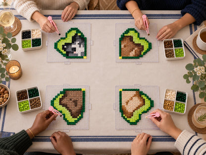 Four complete fuse bead workstations arranged around a table