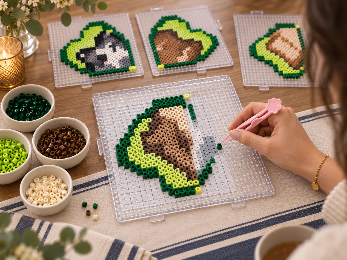 A beginner placing one fuse bead at a time with a pickup tool